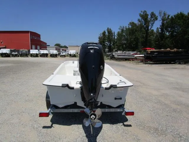 Slide: The Image of 2023 Mako Pro Skiff 17 CC boat on trailer, rear view, outdoor setting. - 5