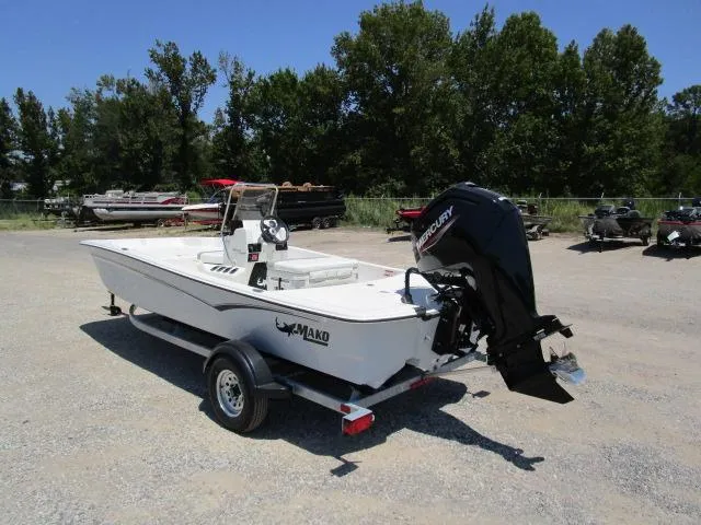 Slide: The Image of 2023 Mako Pro Skiff 17 CC boat on trailer, outdoors, with Mercury engine. - 6