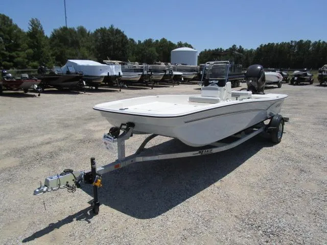 Slide: The Image of 2023 Mako Pro Skiff 17 CC boat on trailer in outdoor lot. - 8