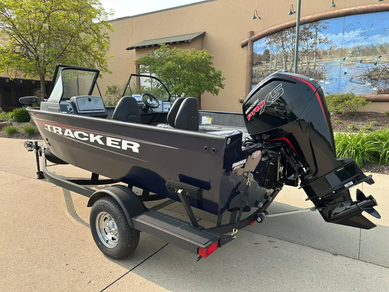 Slide: The Image of 2025 Tracker Pro Guide V-175 WT boat on trailer, outdoor setting. - 2