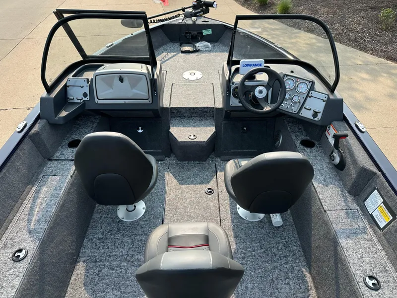 Slide: The Image of 2025 Tracker Pro Guide V-175 WT boat interior with dual seats and steering console. - 7