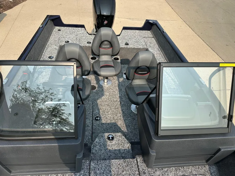 Slide: The Image of 2025 Tracker Pro Guide V-175 WT boat interior with seating and windshield. - 8