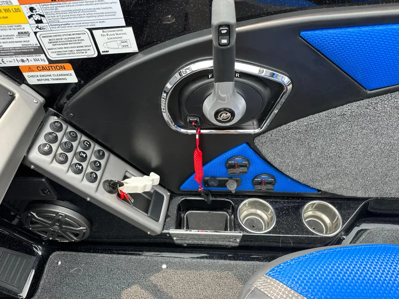 Slide: The Image of Control panel of 2025 Ranger 2080MS boat with throttle and cup holders. - 14
