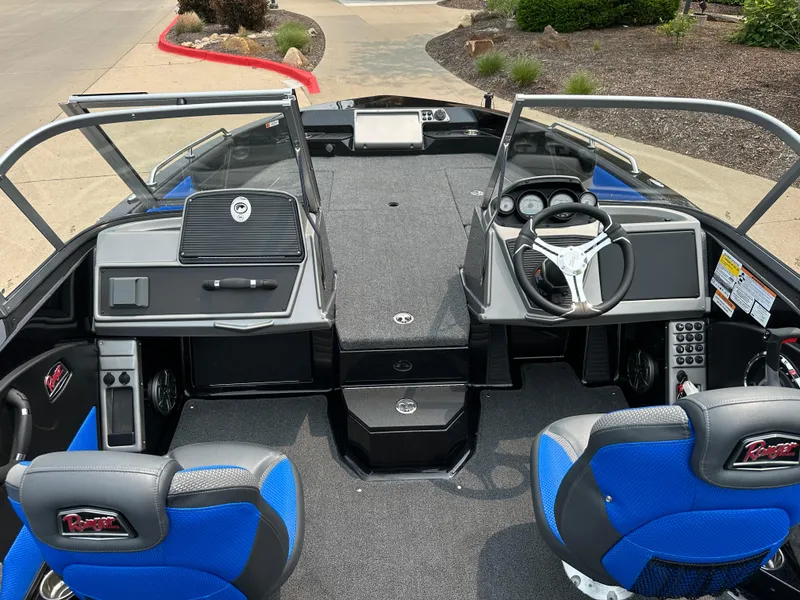 Slide: The Image of Interior view of 2025 Ranger 2080MS boat with blue seats and modern dashboard. - 15