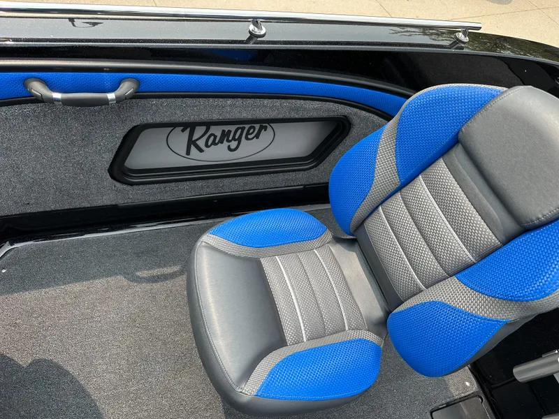 Slide: The Image of 2025 Ranger 2080MS boat interior with blue and gray seating. - 20