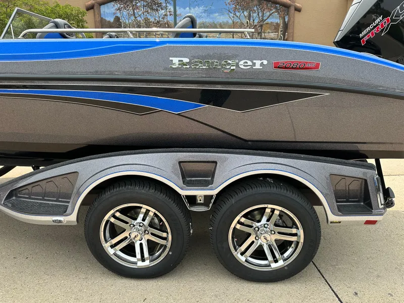 Slide: The Image of 2025 Ranger 2080MS boat with dual-axle trailer, featuring sleek blue and gray design. - 3