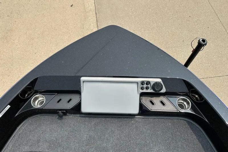 Slide: The Image of 2025 Ranger 2080MS boat dashboard with control panel and cup holders. - 4