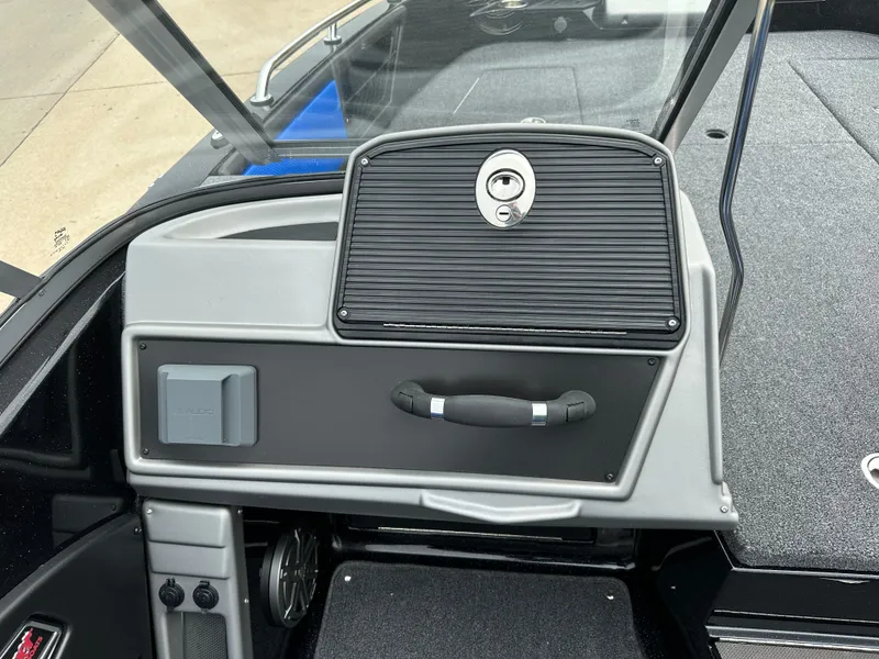 Slide: The Image of 2025 Ranger 2080MS boat dashboard with storage compartment and handle. - 9