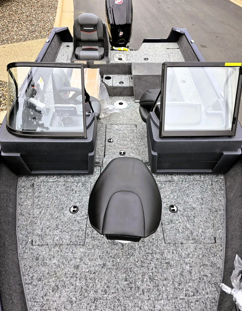 Slide: The Image of 2025 Tracker Pro Guide V-175 Combo boat interior with dual windshields and seating. - 2