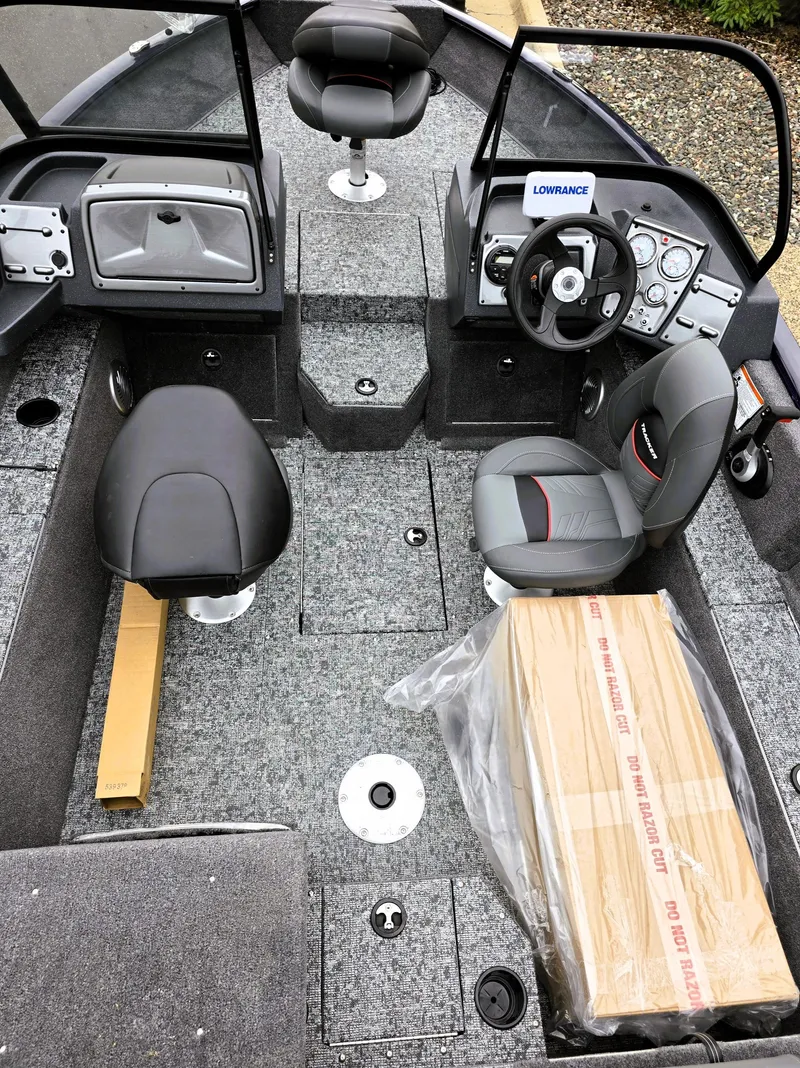 Slide: The Image of 2025 Tracker Pro Guide V-175 Combo boat interior with seating and controls. - 3