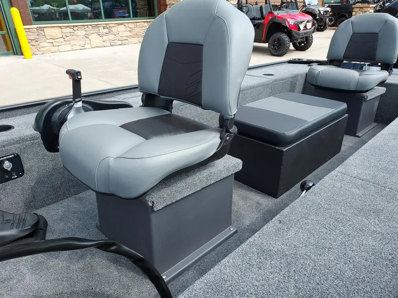 Slide: The Image of 2025 Tracker Panfish 17 boat interior with gray seating and storage compartments. - 2