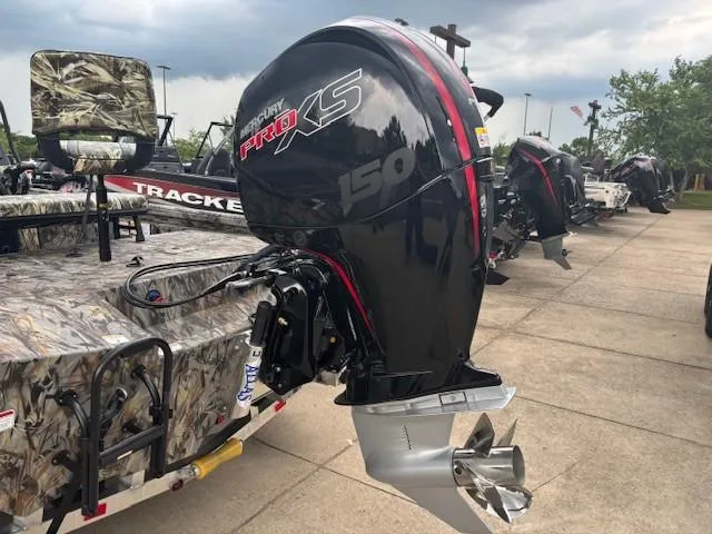 Slide: The Image of Ranger RB200 2025 boat with Mercury Pro XS 150 outboard motor, parked outdoors. - 4