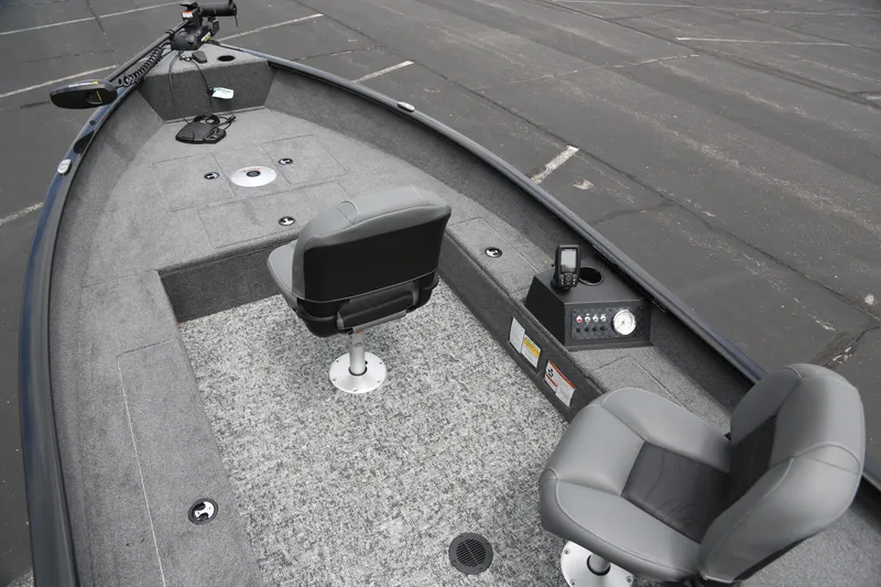 Slide: The Image of 2025 Tracker Super Guide V-16 T boat interior with seating and control panel. - 5