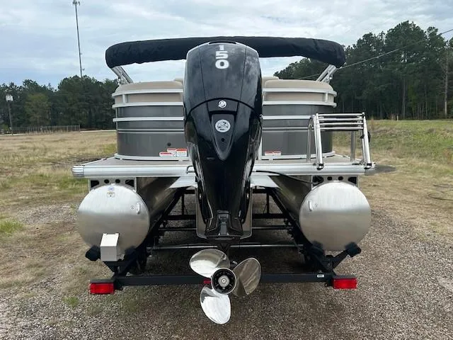 Slide: The Image of 2025 Sun Tracker Party Barge 22 DLX pontoon boat with 150 HP engine, rear view. - 13