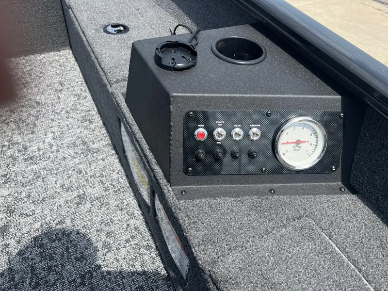 Slide: The Image of Control panel of 2025 Tracker Super Guide V-16 T boat with RPM gauge. - 4