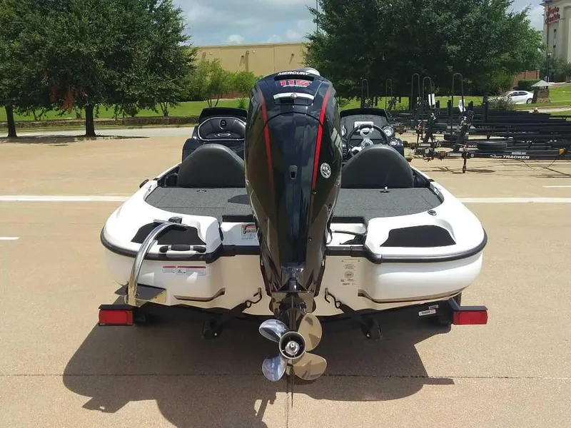 Slide: The Image of 2025 Nitro Z17 boat with powerful outboard motor, parked outdoors. - 10