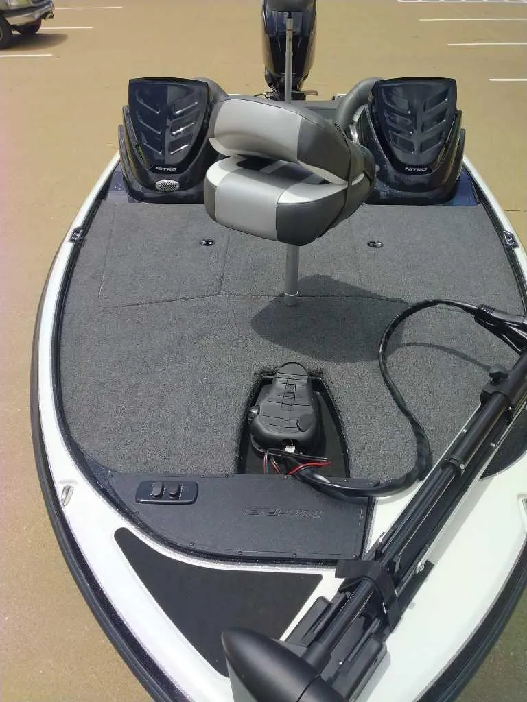 Slide: The Image of 2025 Nitro Z17 boat deck with seating and equipment, featuring dual motors. - 4