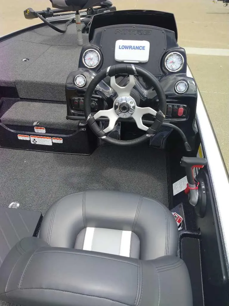 Slide: The Image of 2025 Nitro Z17 boat cockpit with steering wheel and Lowrance display. - 5