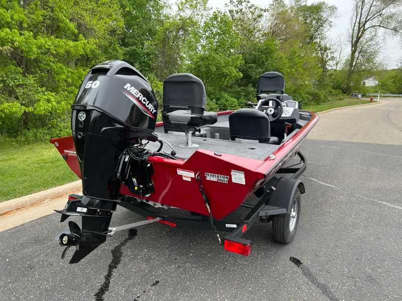 Slide: The Image of 2025 Tracker Pro Team 175 Crappie Edition boat with Mercury engine on a trailer. - 3