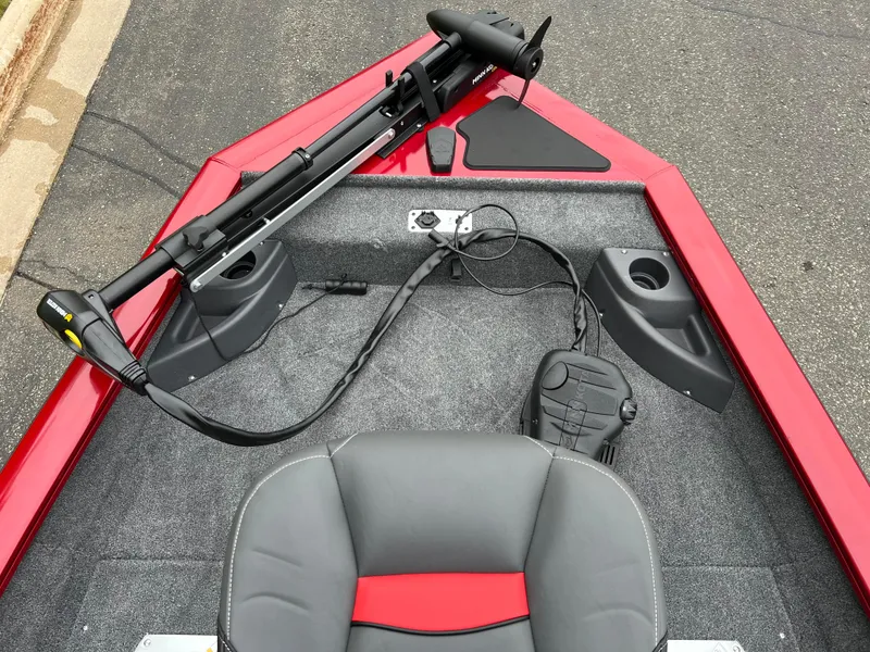 Slide: The Image of 2025 Tracker Pro Team 175 Crappie Edition boat interior with trolling motor and seating. - 4