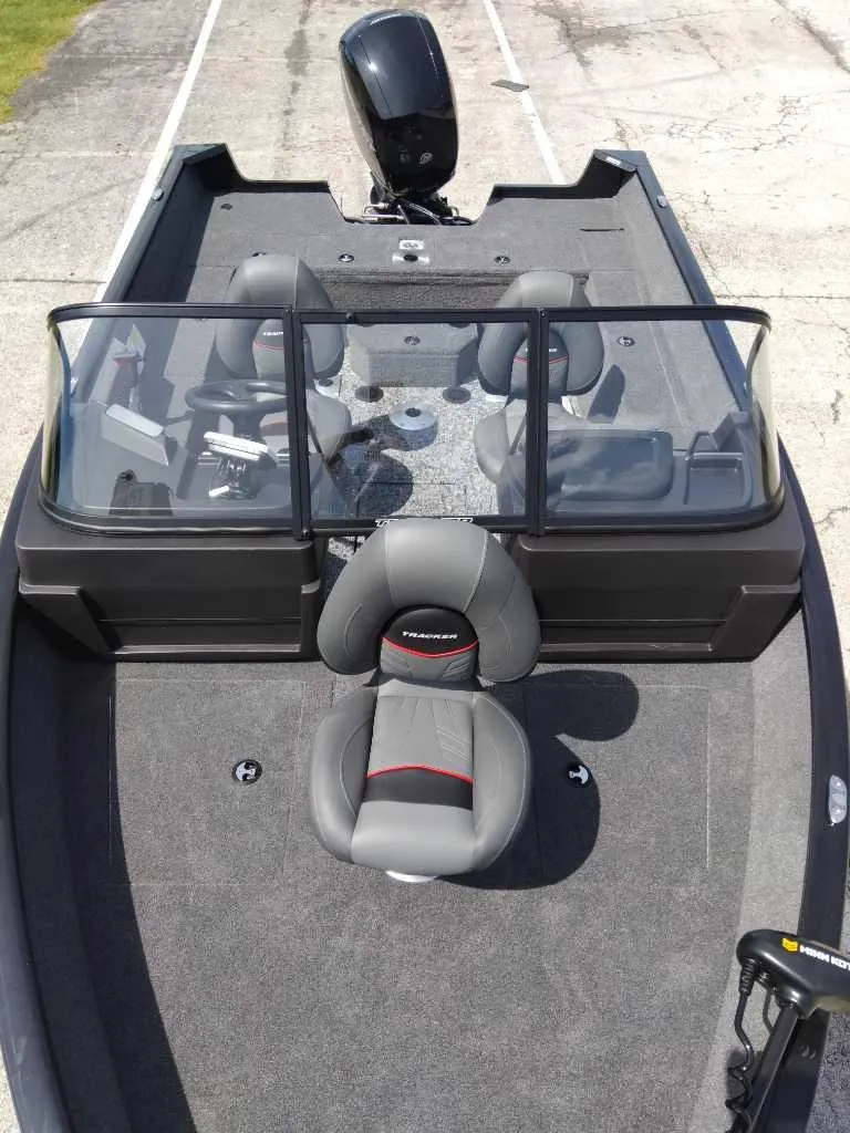 Slide: The Image of 2024 Tracker Pro Guide V-175 WT boat interior with seating and windshield. - 10