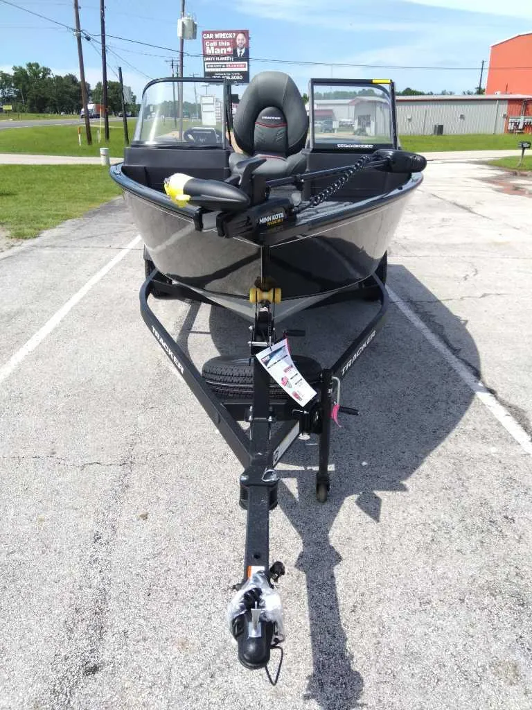 Slide: The Image of 2024 Tracker Pro Guide V-175 WT boat on trailer, parked outdoors. - 3