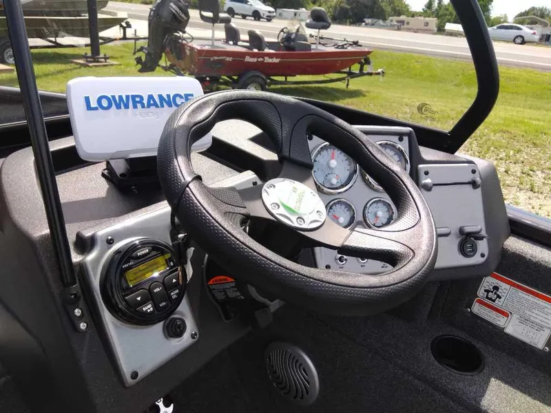 Slide: The Image of 2024 Tracker Pro Guide V-175 WT dashboard with Lowrance GPS and steering wheel. - 8