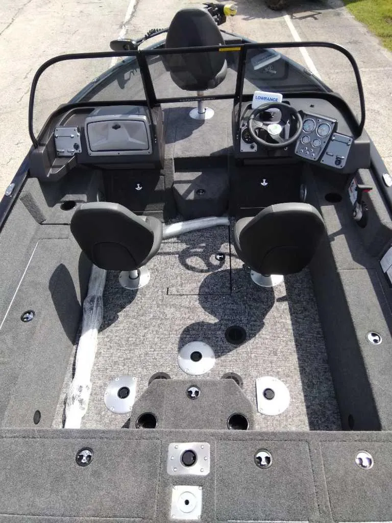 Slide: The Image of 2024 Tracker Pro Guide V-175 WT boat interior with dual seats and control panel. - 9