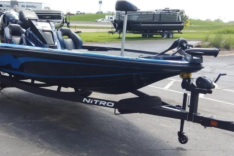 Slide: The Image of 2025 Nitro Z18 boat on trailer in parking lot. - 3