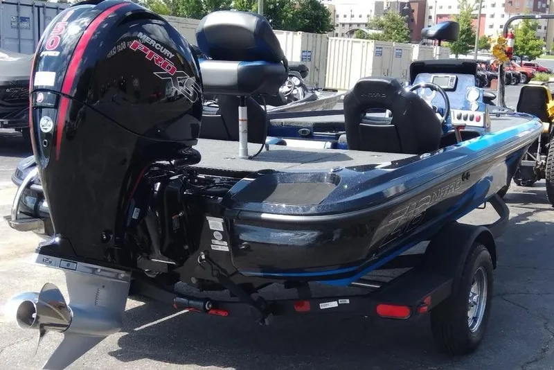 Slide: The Image of 2025 Nitro Z18 boat with Mercury Pro XS engine, parked outdoors. - 4