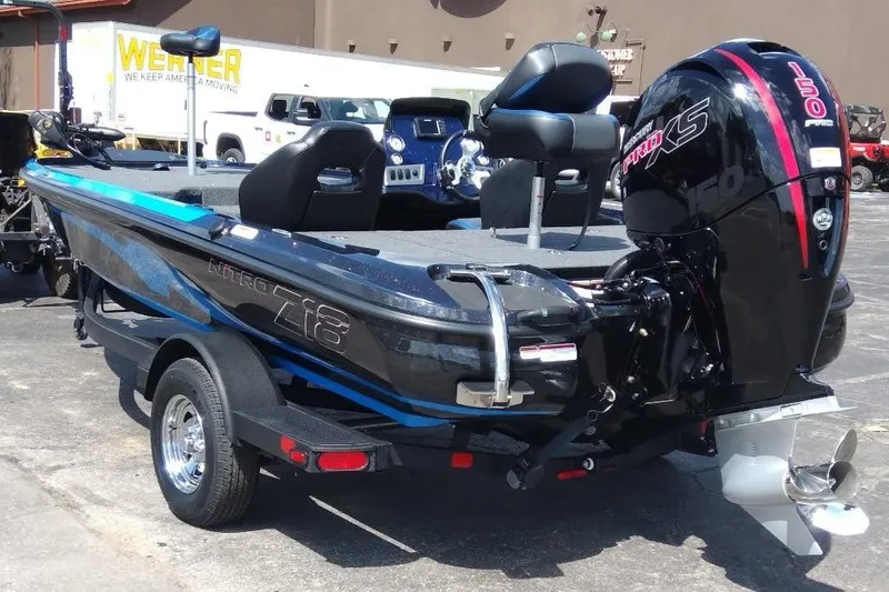 Slide: The Image of 2025 Nitro Z18 boat with powerful 150 Pro XS engine, parked outdoors. - 5