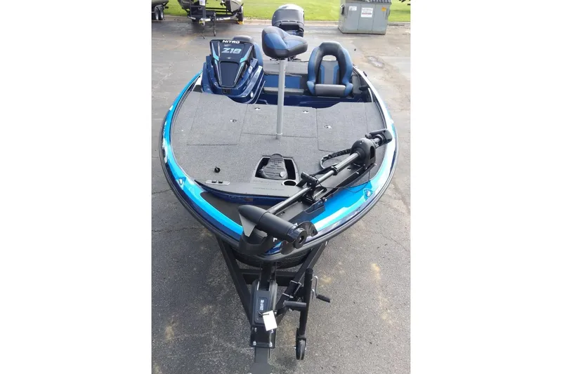 Slide: The Image of 2025 Nitro Z18 boat with blue accents, featuring dual seats and a trolling motor. - 7