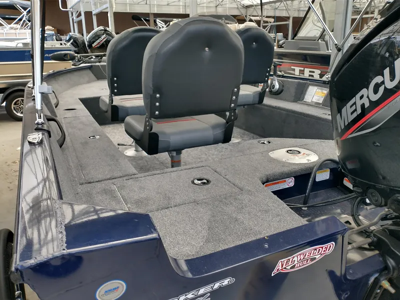 Slide: The Image of 2025 Tracker Pro Guide V-16 SC boat interior with Mercury engine, featuring dual seats. - 3