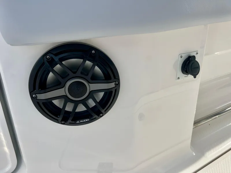 Slide: The Image of Speaker and outlet on 2025 Robalo R300 boat interior. - 17