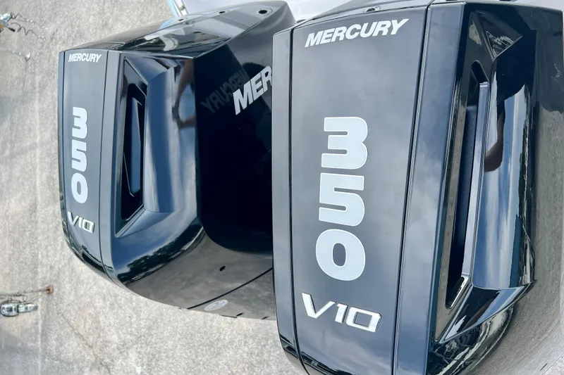 Slide: The Image of Twin Mercury 350 V10 outboard engines on a 2025 Robalo R300 boat. - 37