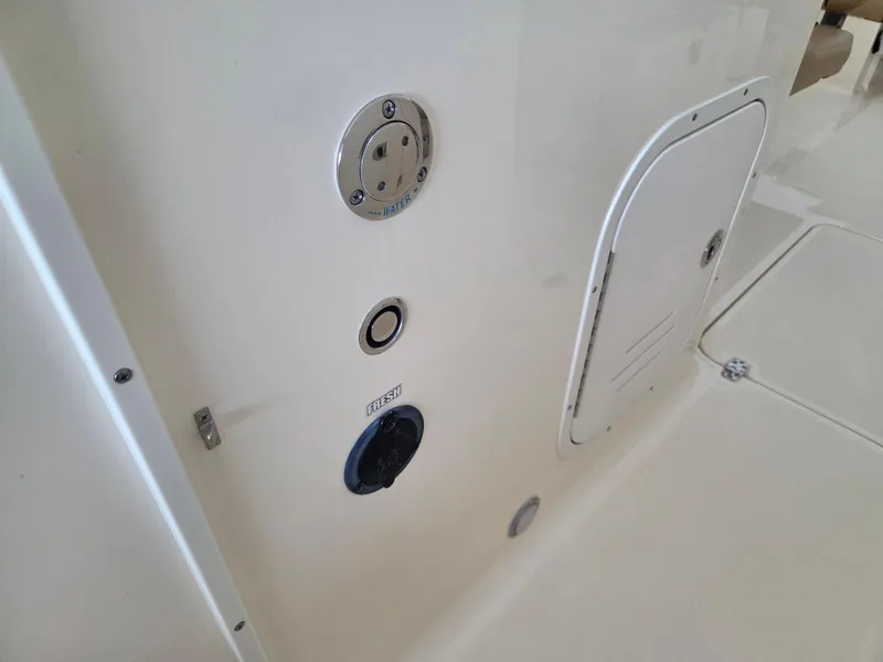 Slide: The Image of 2017 Scout 225 Dorado boat deck with access panel and fittings. - 19