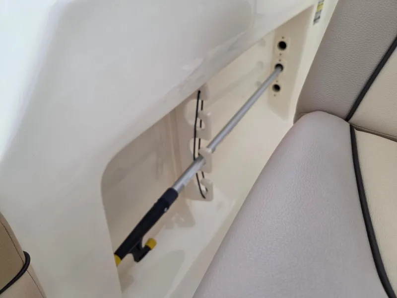 Slide: The Image of 2017 Scout 225 Dorado boat interior detail showing storage compartment and seating. - 24