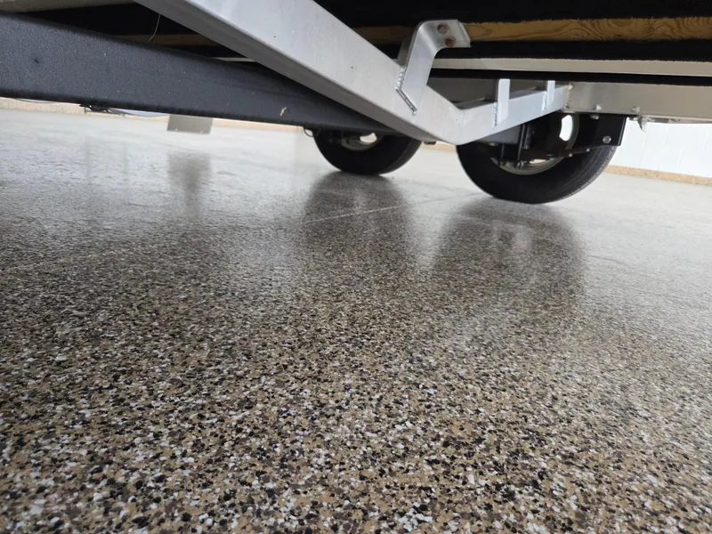 Slide: The Image of Underneath view of a 2017 Scout 225 Dorado trailer on a polished concrete floor. - 32