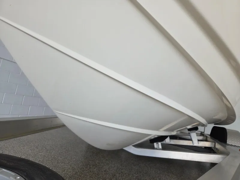 Slide: The Image of 2017 Scout 225 Dorado boat hull on trailer, close-up view. - 6