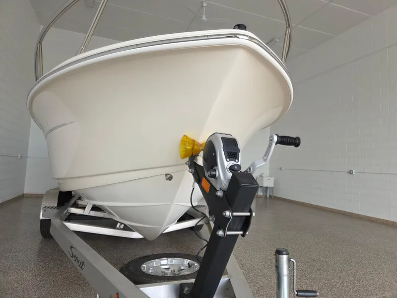 Slide: The Image of 2017 Scout 225 Dorado boat on trailer in indoor showroom. - 7