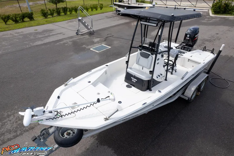 Slide: The Image of 2016 Blue Wave 2200 STL boat on trailer, parked outdoors. - 1