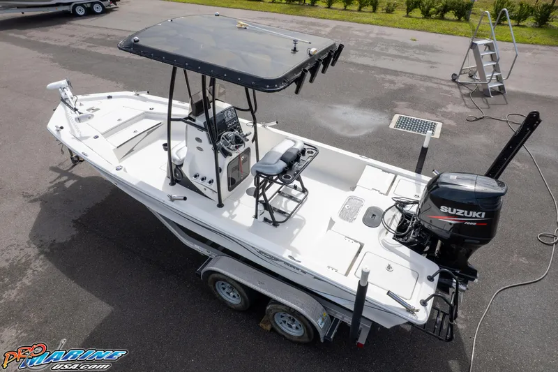 Slide: The Image of 2016 Blue Wave 2200 STL boat with Suzuki outboard motor on trailer. - 5