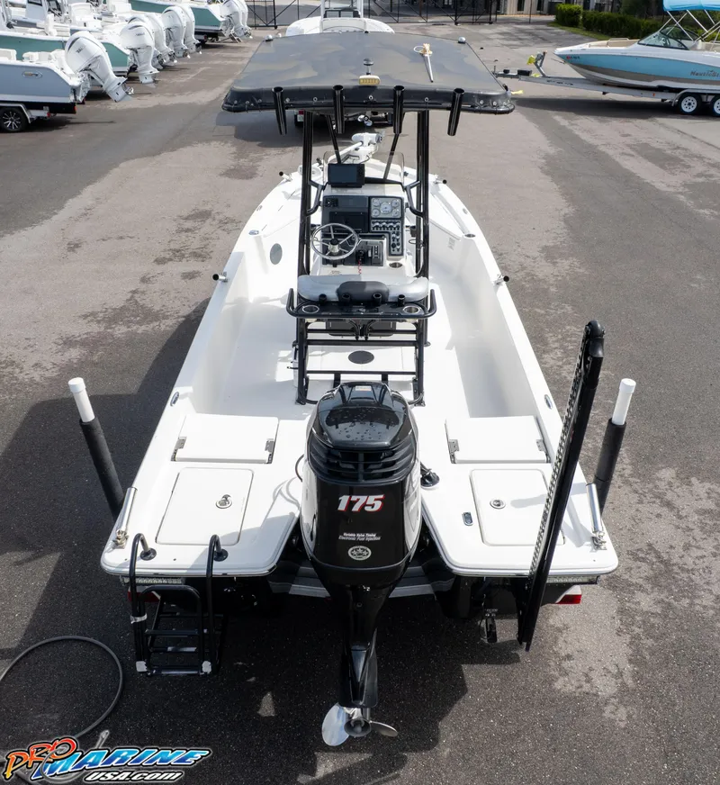 Slide: The Image of 2016 Blue Wave 2200 STL boat with 175 HP engine, docked in a marina. - 7