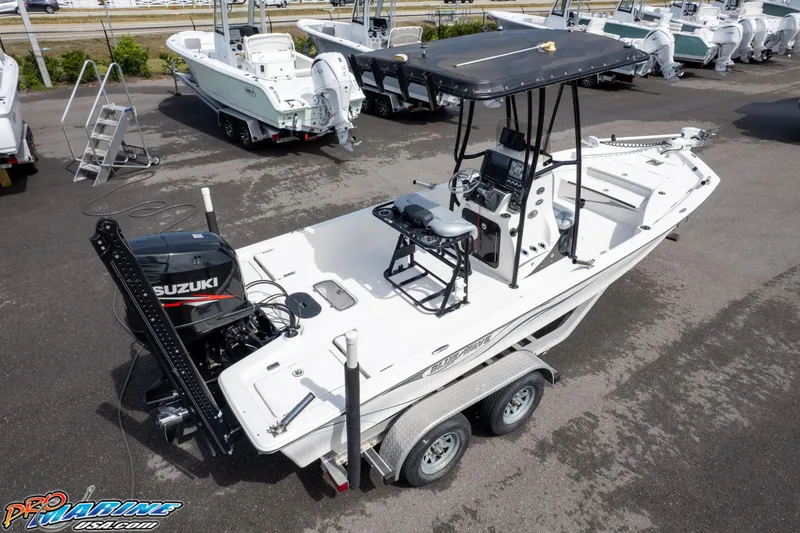 Slide: The Image of 2016 Blue Wave 2200 STL boat with Suzuki engine on trailer in dealership lot. - 9