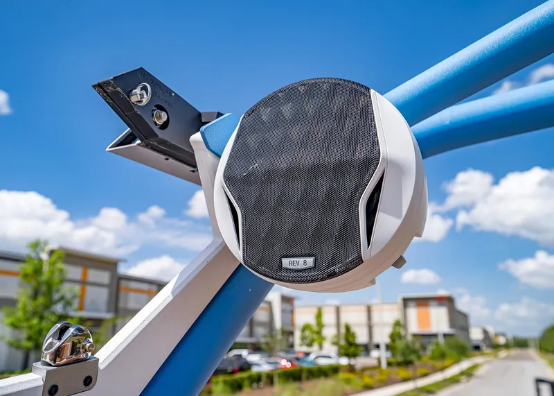 Slide: The Image of 2024 Malibu Wakesetter 24 MXZ boat speaker against a clear blue sky. - 33