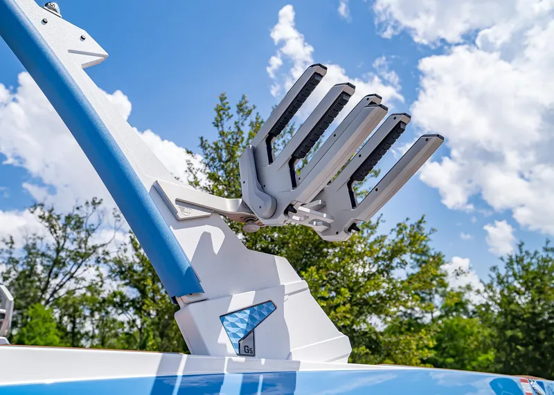Slide: The Image of 2024 Malibu Wakesetter 24 MXZ wakeboard rack against a clear blue sky. - 5
