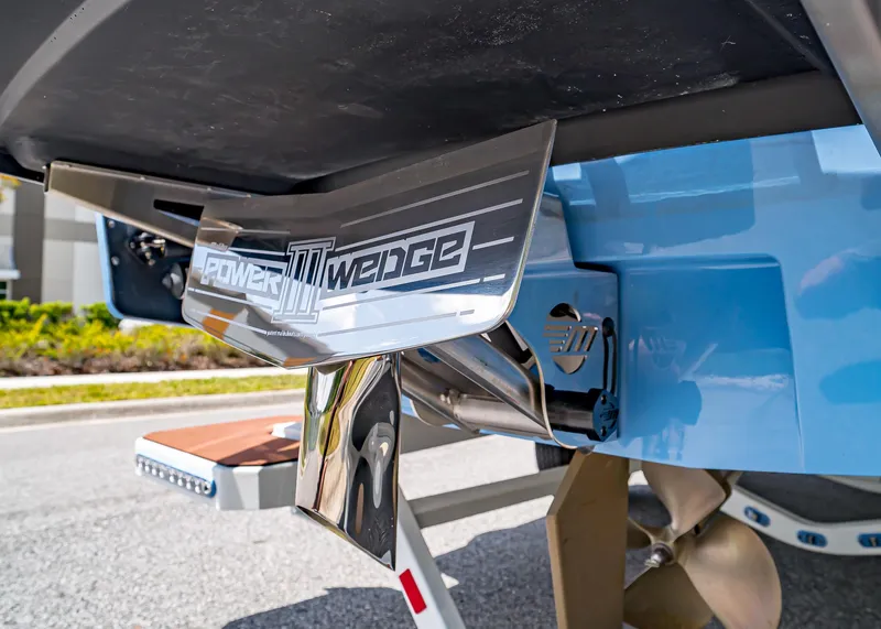Slide: The Image of 2024 Malibu Wakesetter 24 MXZ Power Wedge III detail, showcasing advanced wakeboarding technology. - 8