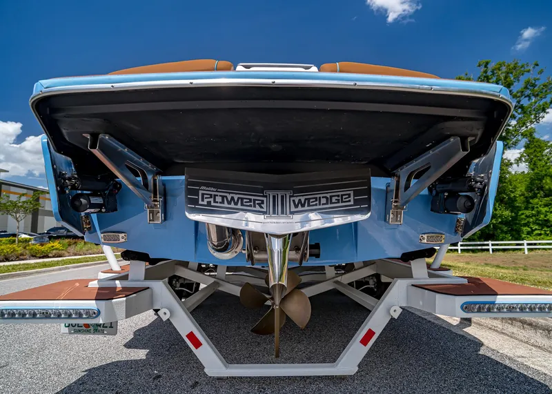 Slide: The Image of 2024 Malibu Wakesetter 24 MXZ boat rear view with Power Wedge III feature. - 9