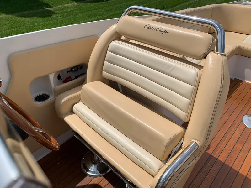 Slide: The Image of 2012 Chris-Craft Launch 28 boat seat with tan leather and chrome accents. - 19
