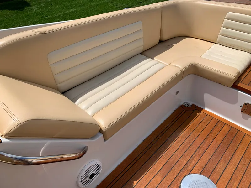 Slide: The Image of Luxurious beige seating on 2012 Chris-Craft Launch 28 boat with teak flooring. - 23